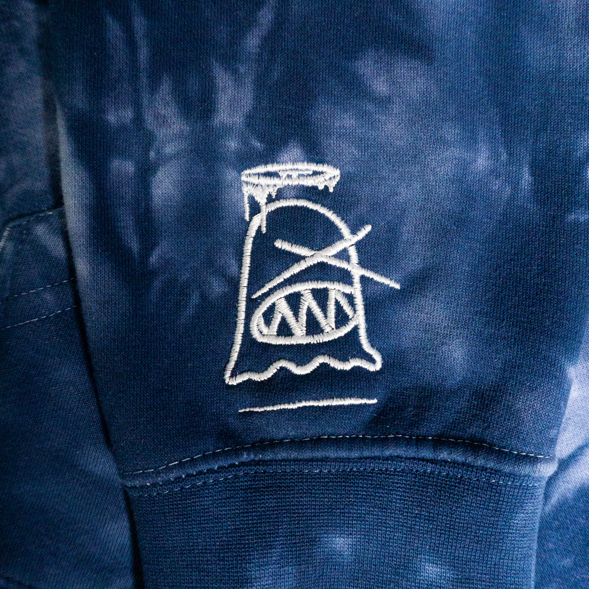 Pray For Your Enemies (More Blessings) Hoodie (Navy Tie-Dye) — ghost sleeve detail